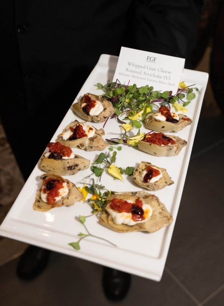 FGF Catering offered an impressive spread that included whipped goat cheese on roasted artichokes with balsamic-marinated tomato. (Photo by George Fiala)