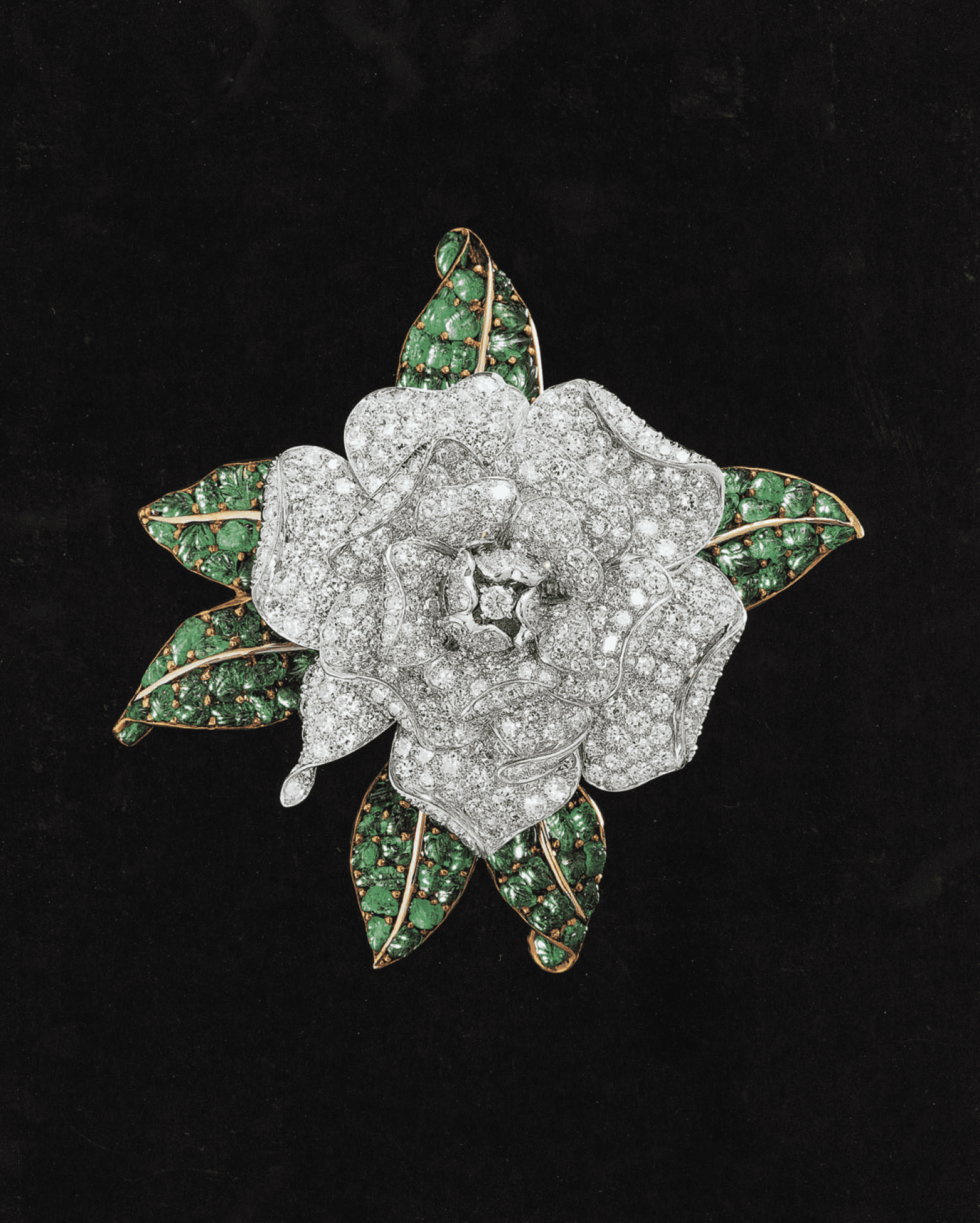 A stunning diamond, emerald, platinum and gold gardenia brooch made in 1939 for Black, Starr & Frost - Gorham, before Oscar Heyman began designing under its own name. Image from the book "Oscar Heyman: the Jewelers' Jeweler," Museum of Fine Arts Boston Publications