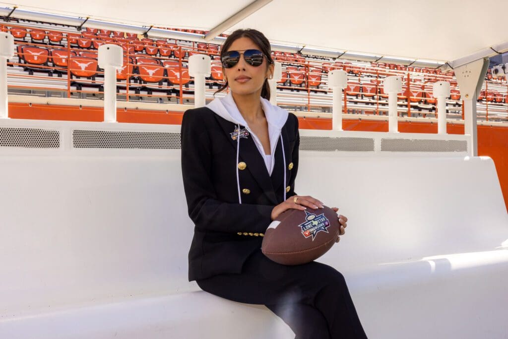 Zinat Ahmed with the custom branded Cotton Lone Star Showdown football by Lucchese (Photo courtesy of Cotton Holdings) (Photo by Courtesy of Cotton Holdings)
