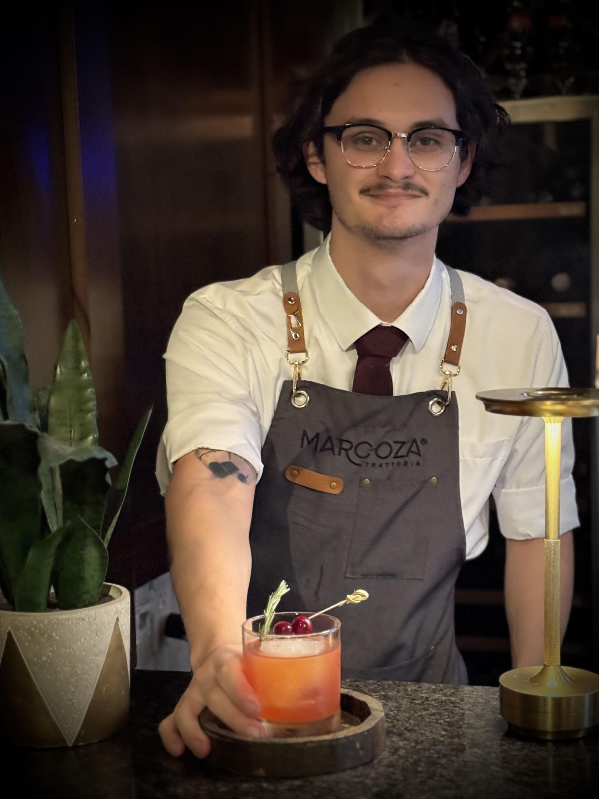 Marcoza Trattoria's David Aguilar makes a By the Fireside holiday cocktail. (Photo courtesy of Sherri Segari)