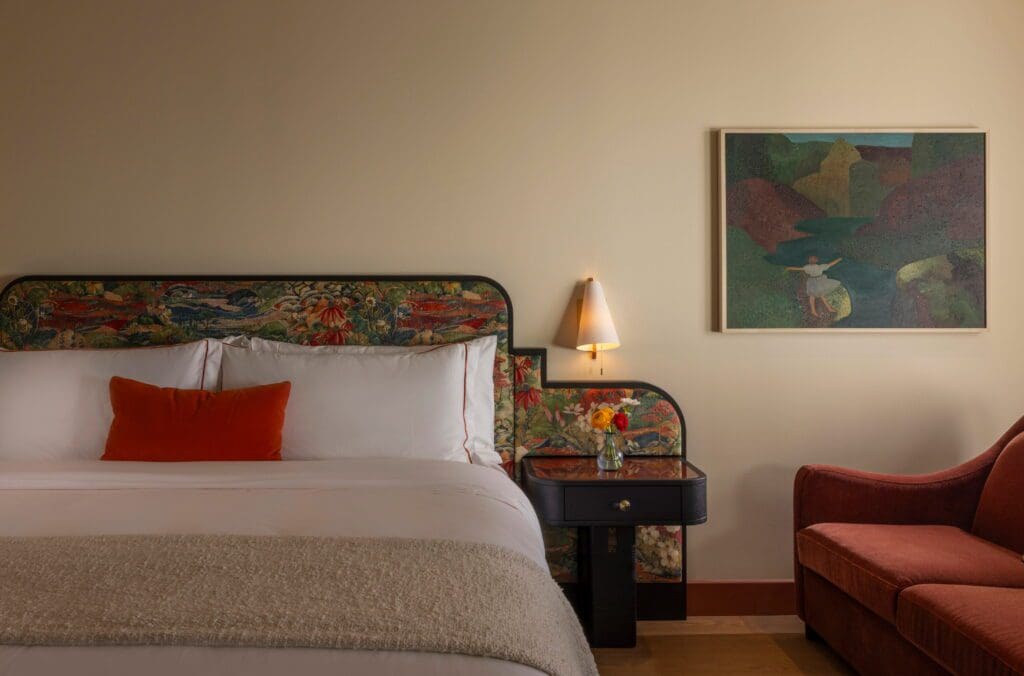 A room with artwork by Austin-based Alexandra Valenti, who was commissioned to create paintings for all guest rooms. (Photo by Julie Soefer)