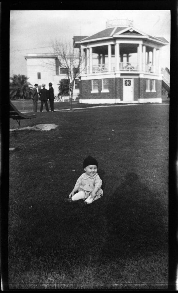 Milton [Robert] Rauschenberg in front of the bandstand in Gates Memorial Park, with Port Arthur Library in background, Port Arthur, Texas, 1927 (Robert Rauschenberg Foundation Archives, New York)
