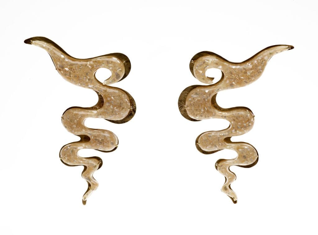 Taisha Carrington, Waves hair brooches, 2021, from the series I
Had a Dream of a New Old Caribbean, editioned: no. 1 of 4, crushed
West Indian wilks (sea snail) shell, resin, brass and silver, Dallas
Museum of Art, Discretionary Decorative Arts Fund, 2022.47.A-B. ©
Taisha Carrington. Photo by Chad Redmon, courtesy Dallas
Museum of Art.