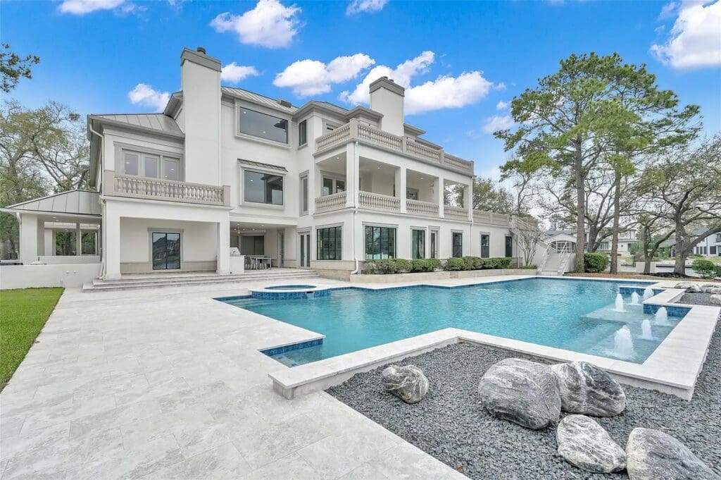 The romantic elegance at 10 W Isle Place is the perfect backyard leading to private lake access. 