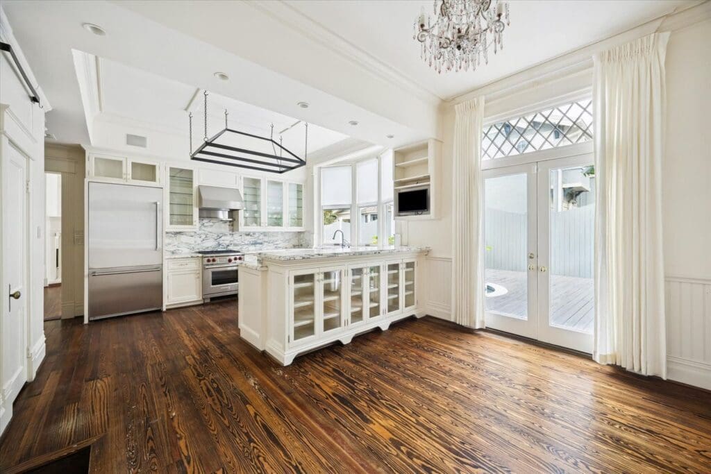 The kitchen at 200 Westmoreland boasts a Wolf range and as with the entire house original hardwood floors. (Photo by TK Images)