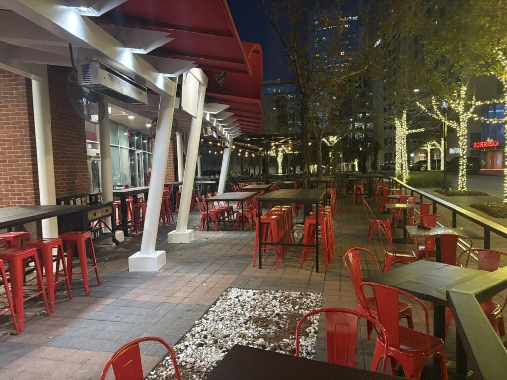 Lankford’s patio has space heaters and fans with a great view of The Woodlands Waterway. (Photo by Laura Landsbaum)