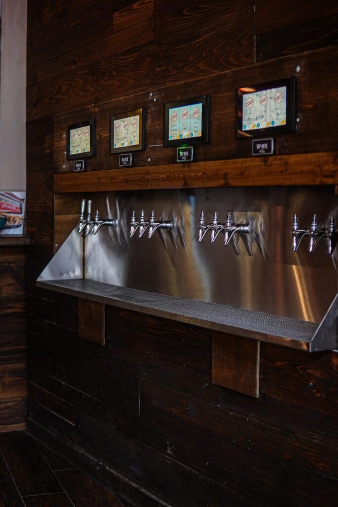 A 12-tap beer wall lets guests pour their own beer by the ounce. (Photo courtesy of Lauren Lutz)