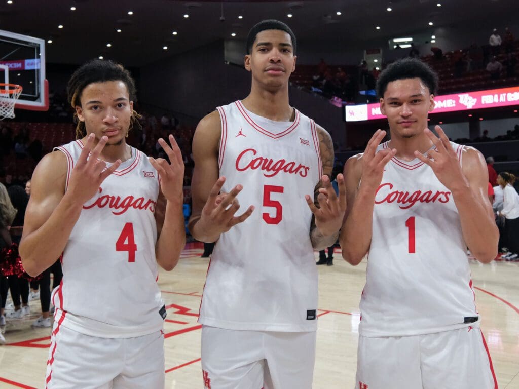 University of Houston's terrific trio of freshmen — starters Kingston Flemings and Chris Cenac Jr. and Isiah Harwell — share a moment. (Photo by F. Carter Smith)