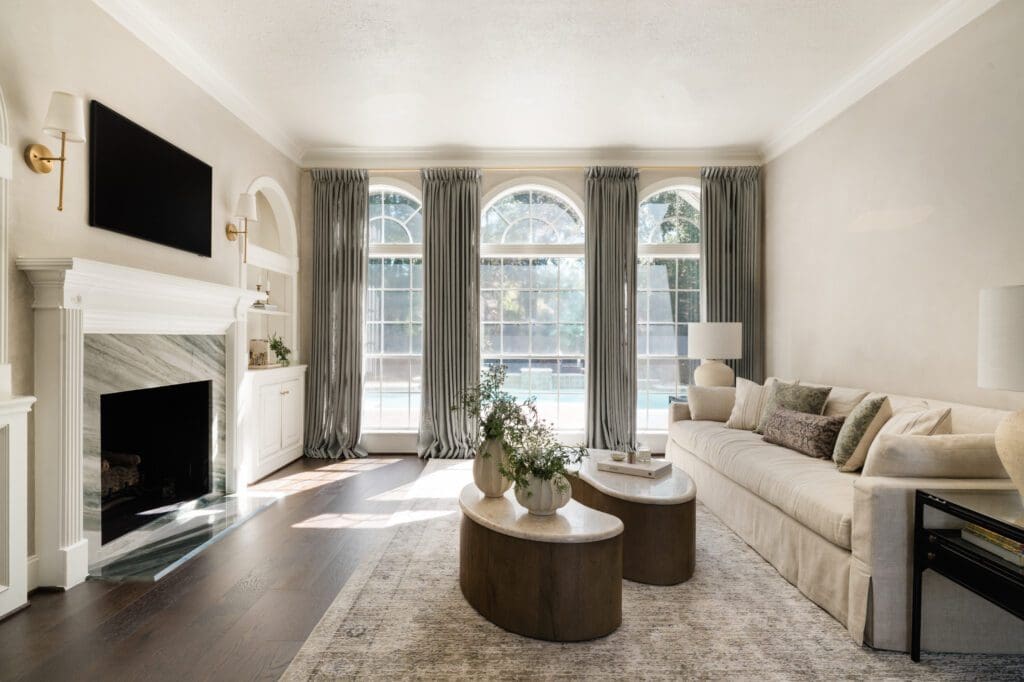 A new fireplace surround, paint and drapery bring the formal living room to life. (Photo by Madeleine Harper Photography)