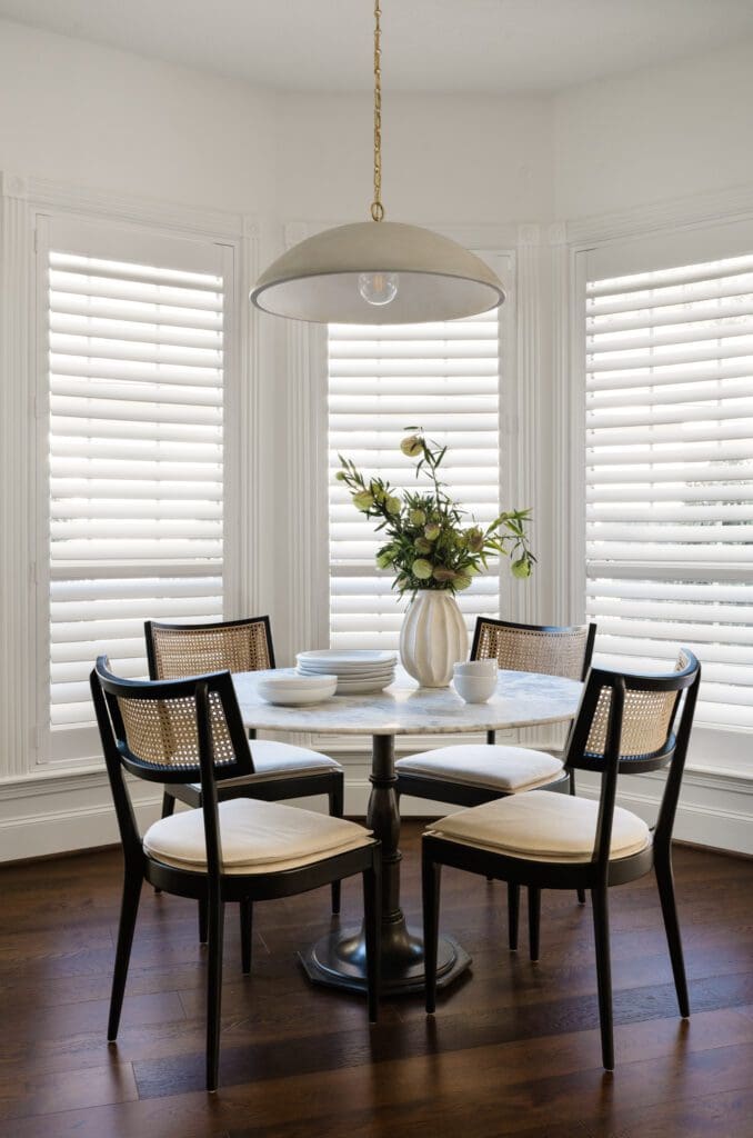 New lighting in the breakfast nook and natural light keep the room fresh and bright in this Palmer Woods house. (Photo by Madeleine Harper Photography)