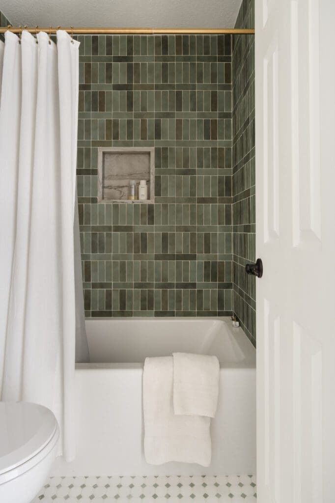 An upstairs bath in the Palmer Woods house got an update with fresh tile in a Jack and Jill space. (Photo by Madeleine Harper Photography)