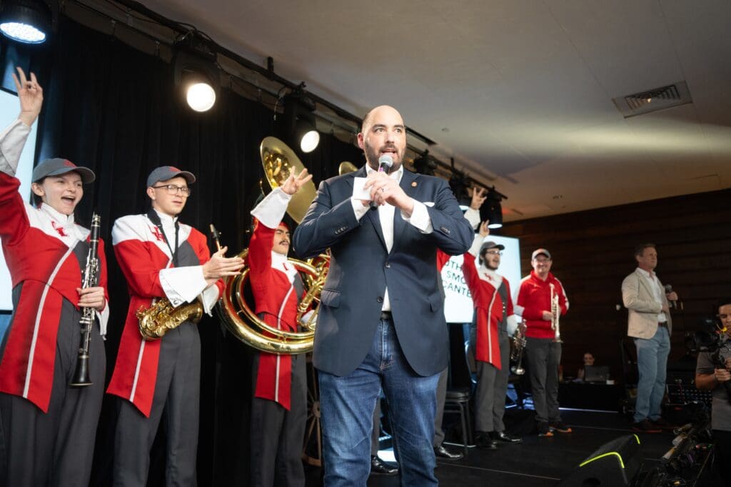 Master Sommelier Steven McDonald, Frank Bullington, and the University of Houston Marching Band. (Photo by Photos by Daniel Ortiz)