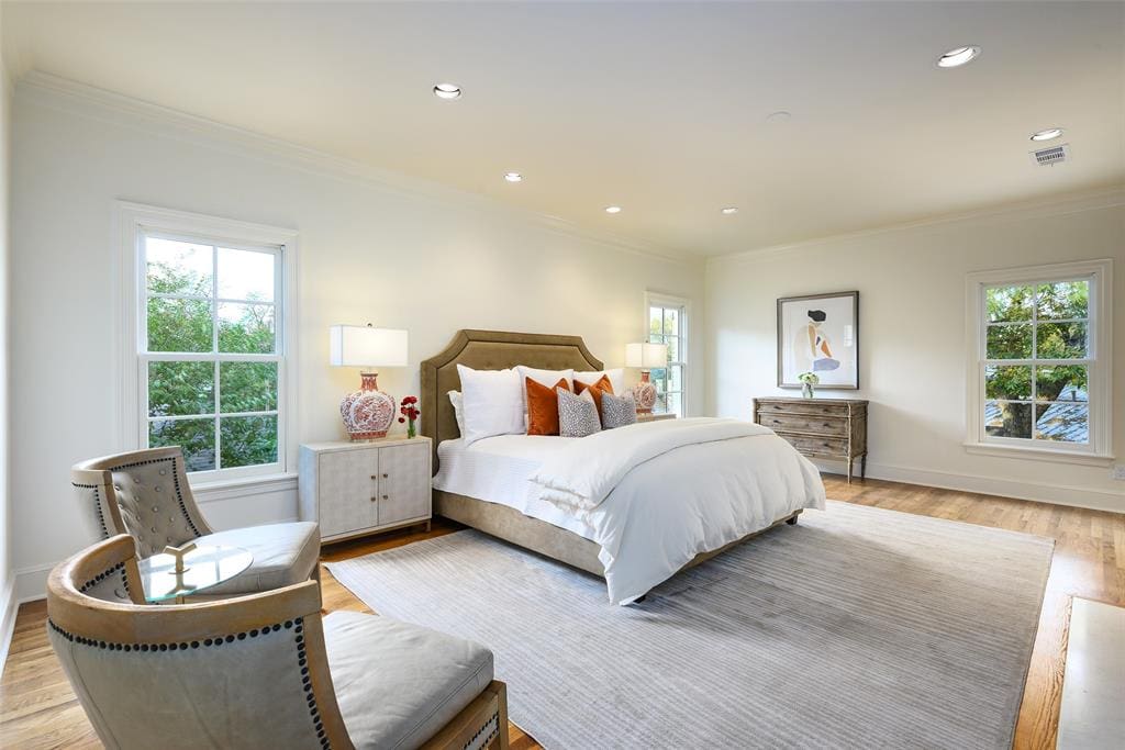 Located on the second floor, the primary suite provides treetop views from a covered terrace. (Photo by Compass RE Texas, LLC)