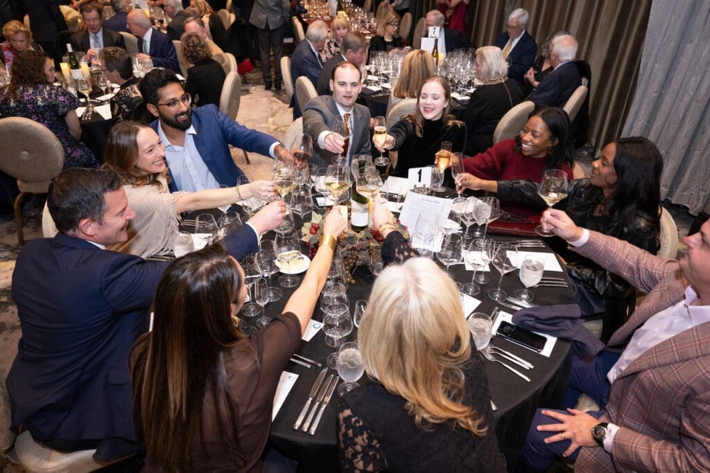 Cheers to the T.J. Farnsworth table at CanCare's 'Hope Uncorked' dinner. (Photo by Jacob Power)