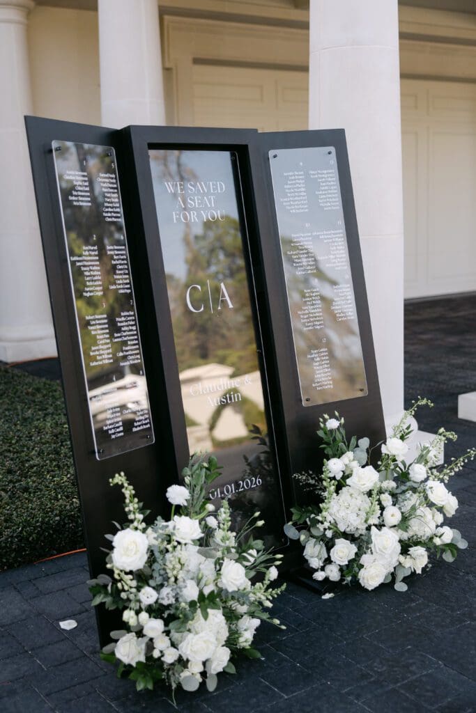 The wedding seating chart featured florals by Piney Woods Florals. (Photo by Weddings by Trey)