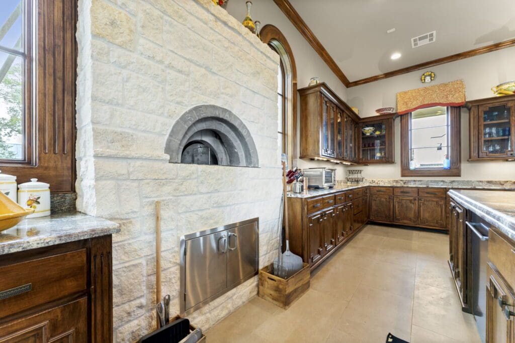 The kitchen with built in pizza oven at 6 W. Rivercrest Drive (Photo by Iconic Images)