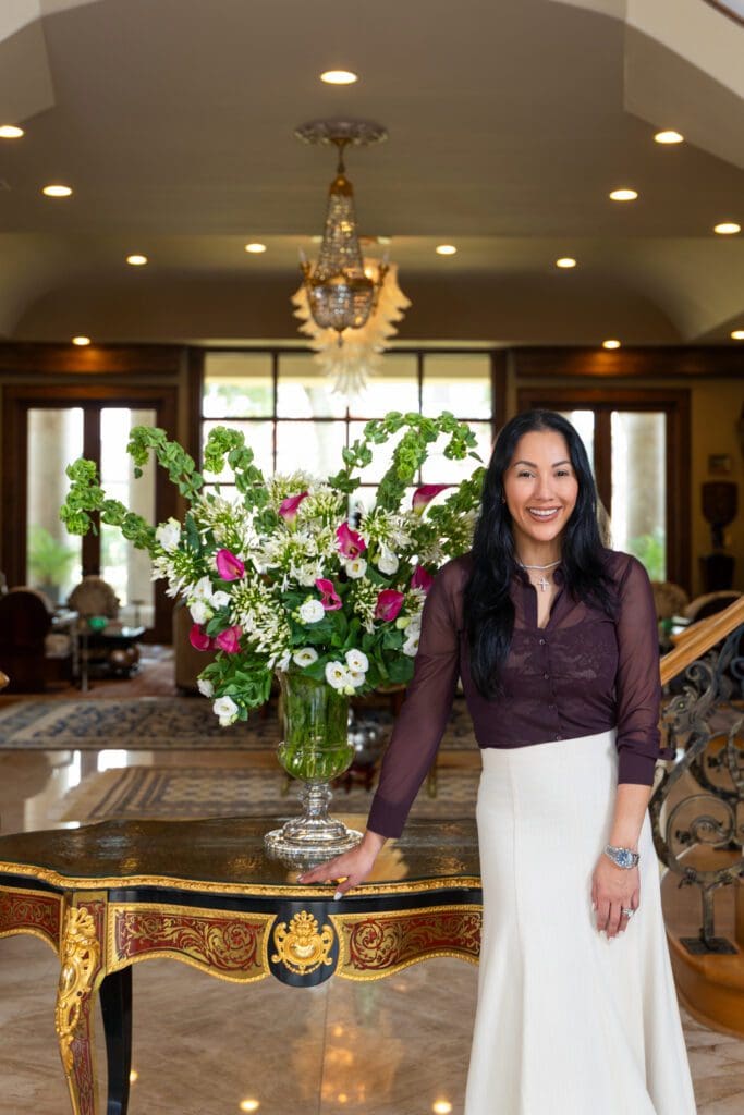 Nancy Almodovar of Nan & Company Properties with her listing at 6 W. Rivercrest Drive (Photo by Laurie Perez)