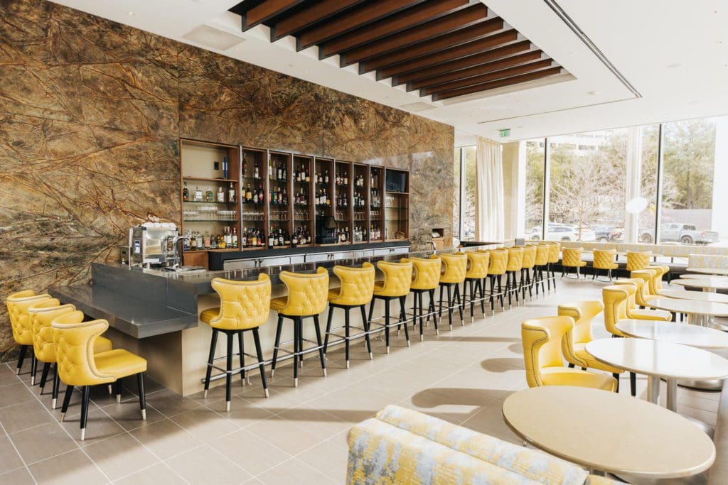 61-Osteria-The-dramatic-yet-sunny-bar-at-61-Osteria-backed-by-bookmatched-Indian-marble.-Photo-by-Kathy-Tran.-1024×683