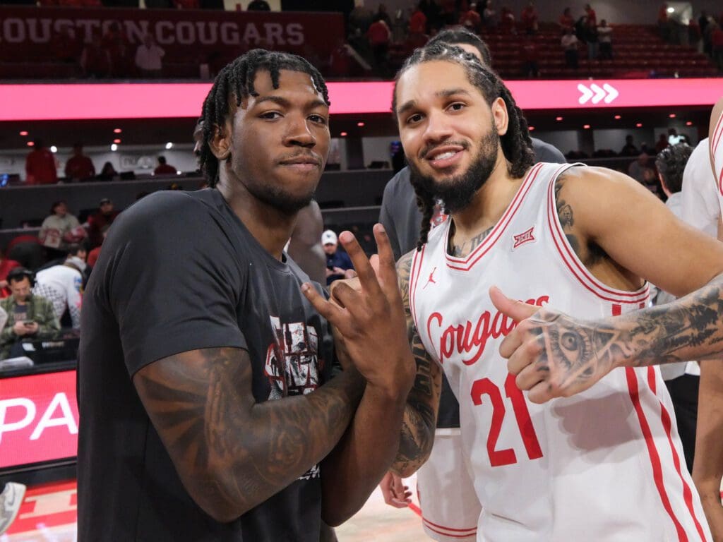 University of Houston senior guard Emanuel Sharp (right) gives Kordel Jefferson some love. (Photo by F. Carter Smith)