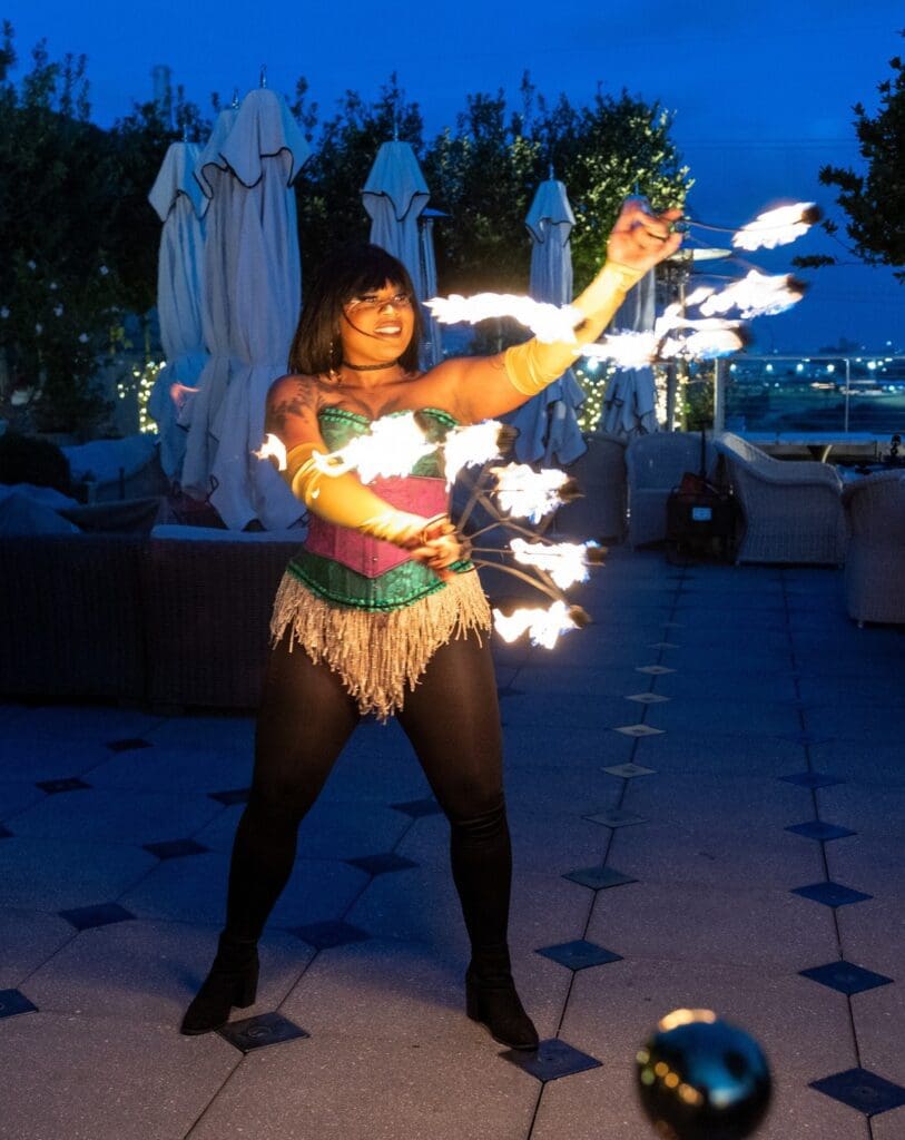 Fire performer  at LEAD's sixth annual Mardi Gras Charity Event 