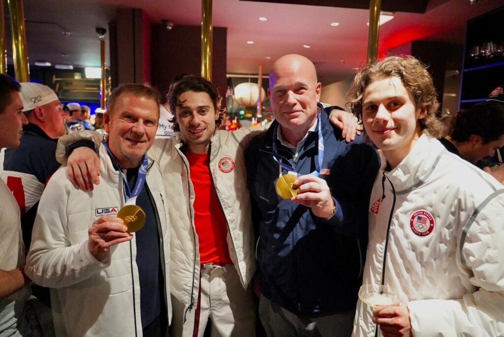 Billionaire Ambassador Tilman Fertitta Celebrates With U.S. Olympic Hockey Hero Jack Hughes, Revels In America’s Gold Haul