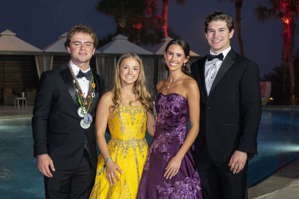 Knights of Momus duchesses Sara Gabriel and Madeline Haver with their escorts at the San Luis Salute (Photo by Jacob Power)