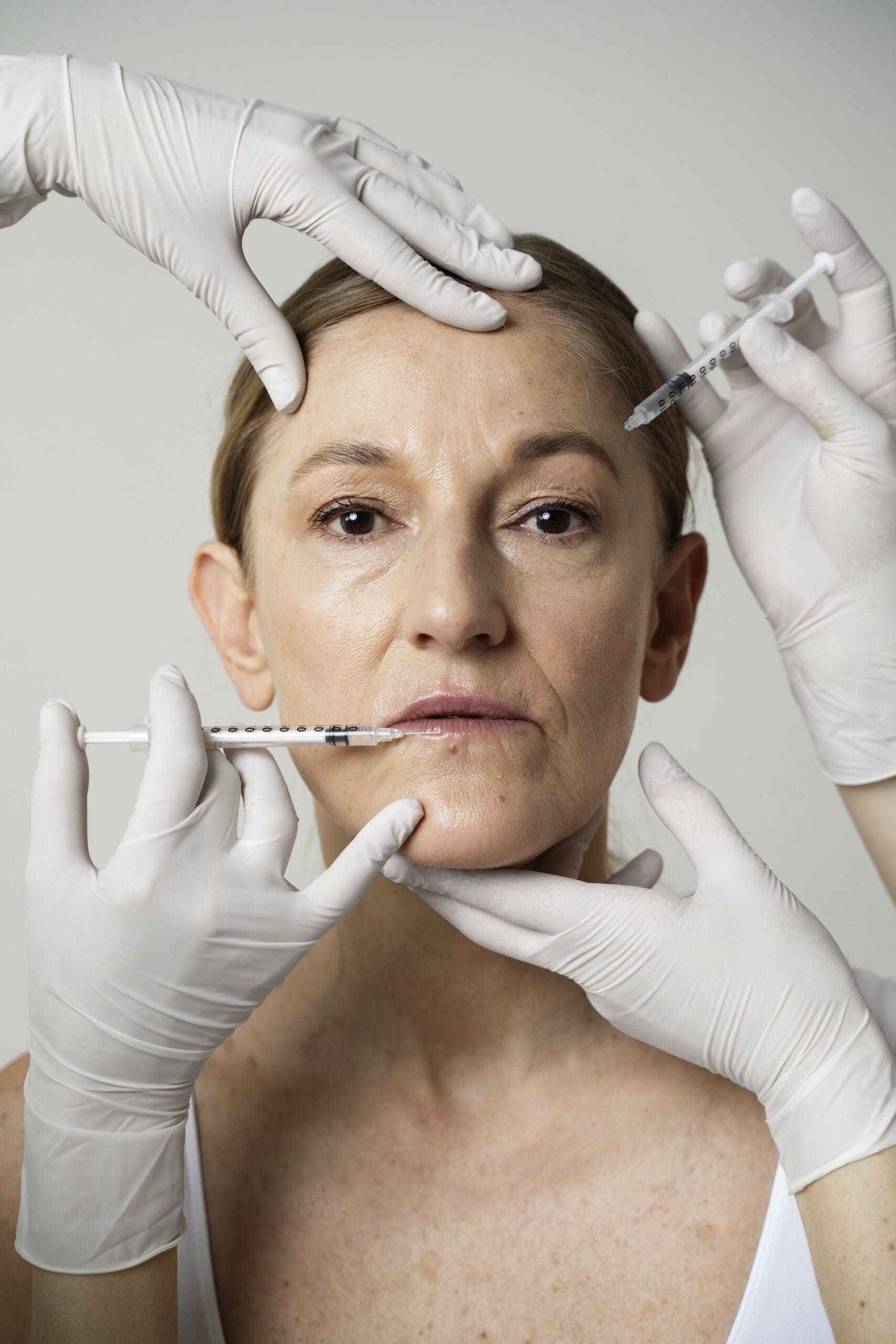 front-view-senior-woman-getting-facial-injections