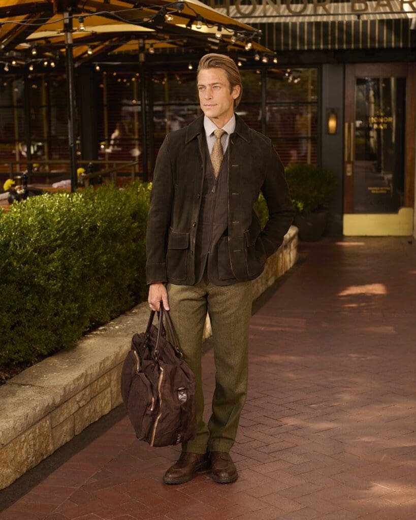 Beretta Gallery delivers a sharp dark brown jacket and duffel that brings a sporting elegance to the spring season. (Photographed at The Honor Bar)