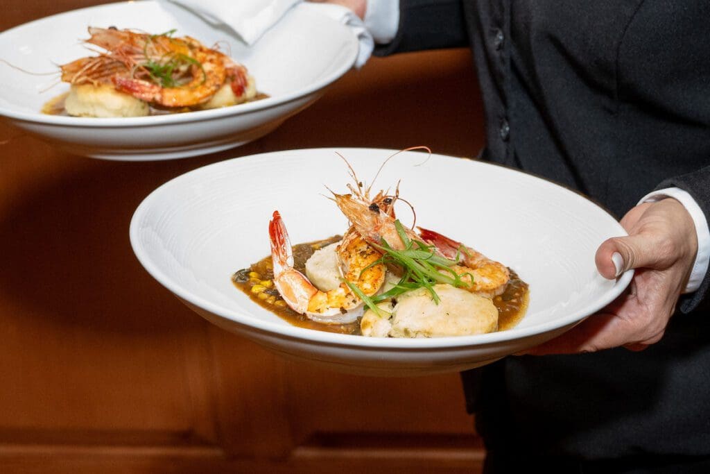 New Orleans BBQ Shrimp with Creole meuniere and Souther biscuits served at the 'Tribute to Louisiana Legends' dinner held at The Manor House at The Houstonian  (Photo by Jacob Power)