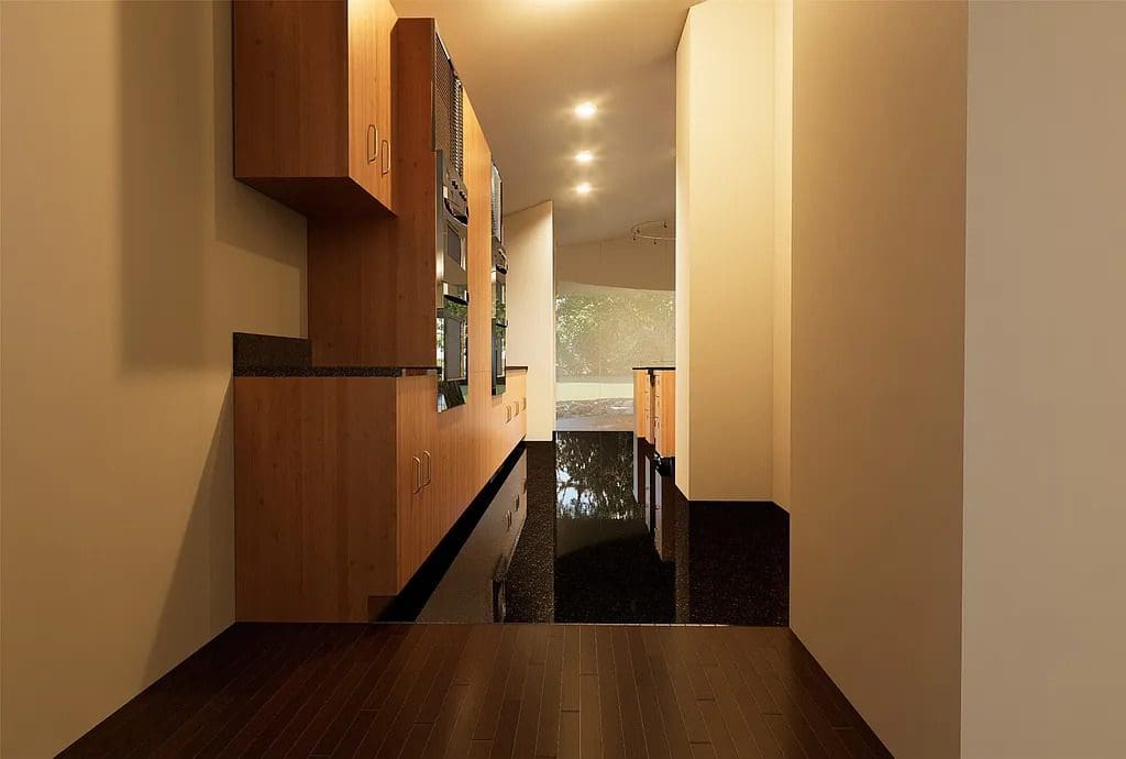 A long interior corridor at 4301 Briarhaven Road features sleek wood cabinetry, built-in appliances, and glossy dark flooring that reflects natural light from the windows beyond. (Courtesy)