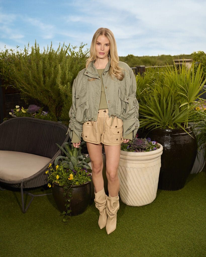 Balmain makes a statement with a blue green gabardine jacket paired with tan utility shorts for the perfect ensemble. (Photographed at Park House)