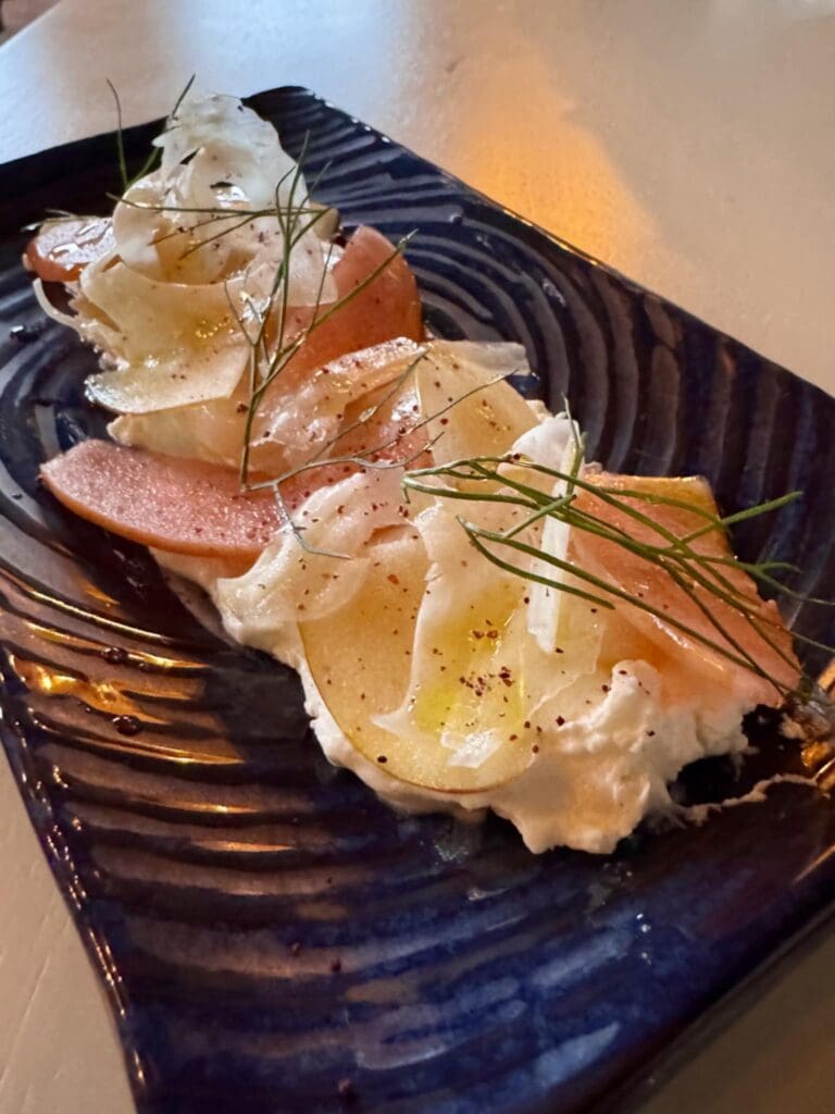 The scallop crudo was texturally rich. (Photo by Walt Burns)