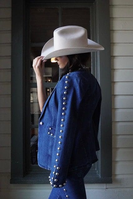 A studded denim jacket pairs with matching denim at Wuensche Bros. (Photo courtesy Pell 1990)