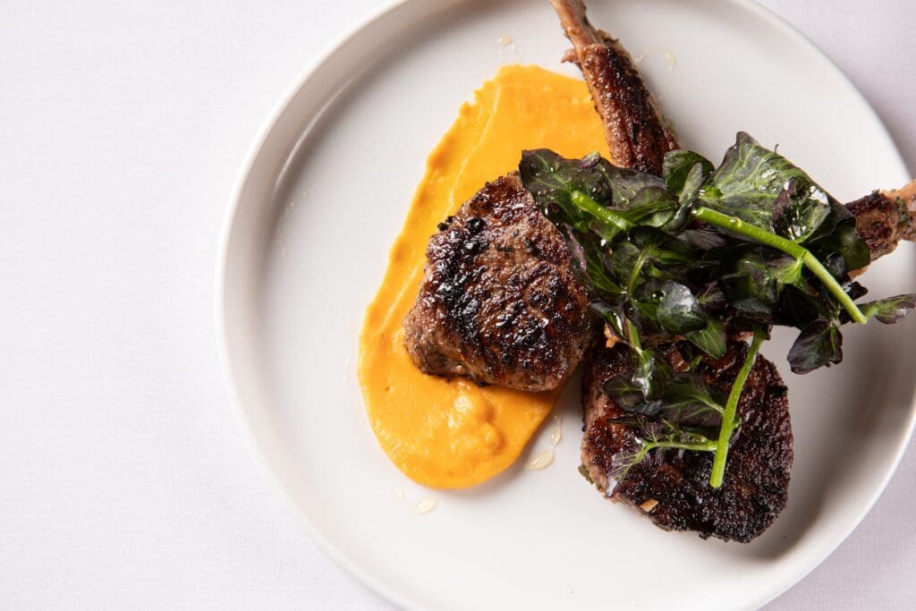 Don't miss the Moroccan-spiced lamb chops (medium-rare, please) accented with a sweet potato purée ($24) at Houston's new Atlantic Ocean restaurant. (Photo by Madelynne Grace)