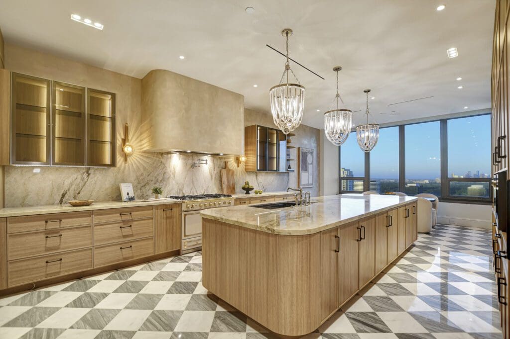 A chef-inspired kitchen featuring premium finishes, custom cabinetry, and expansive island designed for both function and style.