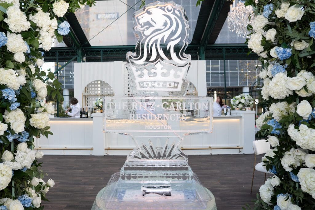 Ice Designs Houston creates a dazzling ice sculpture logo at the gala opening of the Ritz-Carlton Residences, Houston sales office (Photo by Albert Chen Photography)