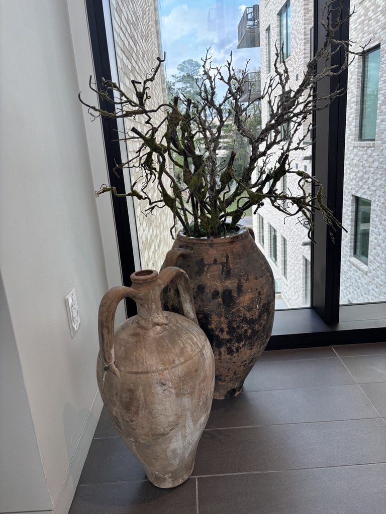 Antique vases throughout 1 Riva Row  are from Living Century.  Each are tagged with the country of origin. (Photo by Laura Landsbaum)