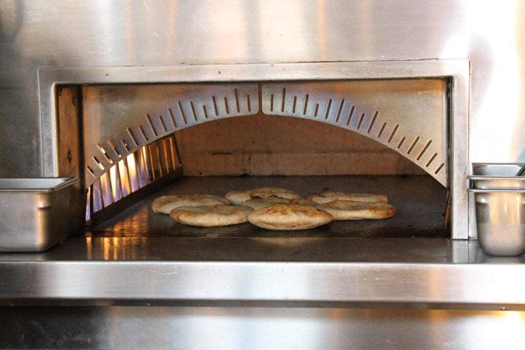 Pita bread is baked to order at the new Brassica on Voss at San Felipe. (Photo by Photos courtesy of Brassica)