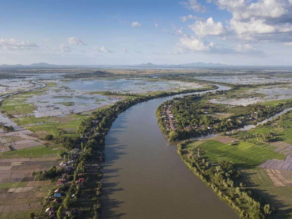 Aerial of Tonle Sap river, village and rice fields, Kampong Prasat, Kampong Chhnang, Cambodia. (photo courtesy of Aqua Expeditions)