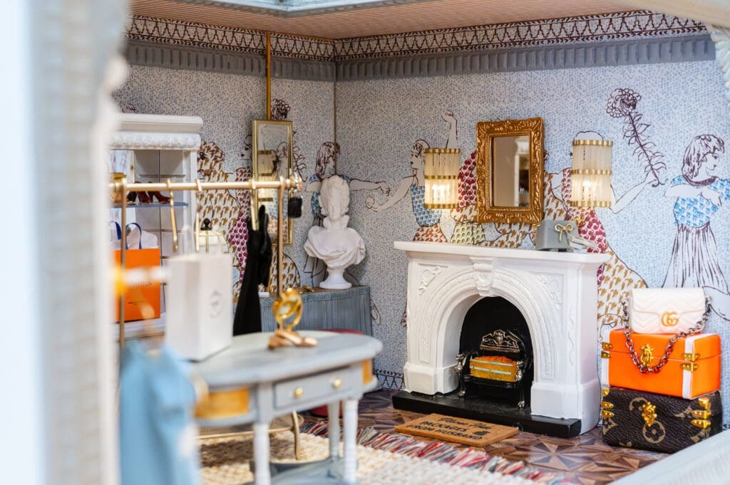 "The Golden Age Dressing Room" by Traci Connell Interiors. Connell acquired the bookcases that hold the handbags and shoes from a miniatures shop in Madrid, Spain.  (Photo by Caroline Guinn Photography)