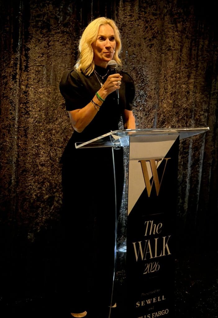 Interfaith president and CEO Missy Herndon welcomes guests gathered to meet the 2026 Community Champions ahead of the August gala. (Photo by Laura Landsbaum)