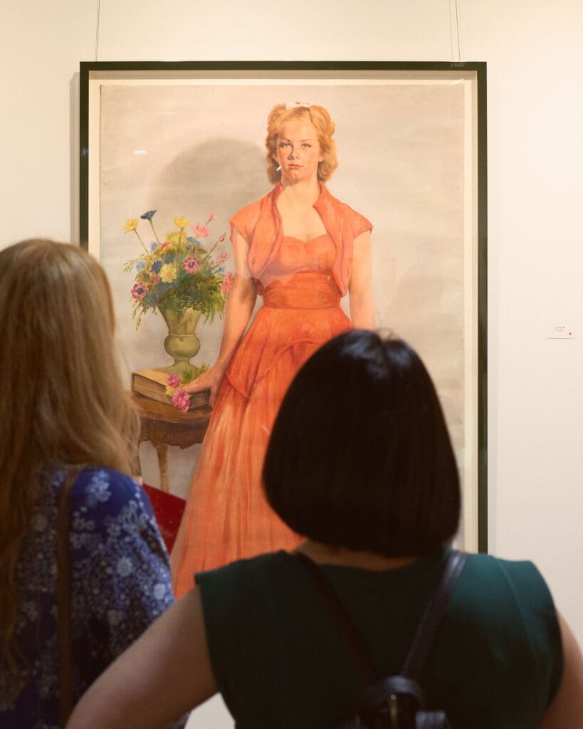 The largest piece in the collection, a five-feet-tall portrait of an angsty teenager posing in a bright orange dress, perhaps drew the most attention. (Photo by Heather Halbert)