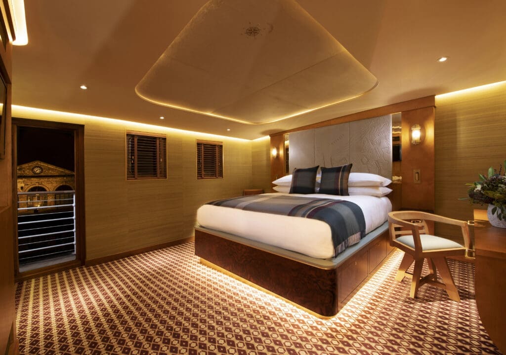 The ship turned boutique hotel was meticulously designed by the award-winning team behind the iconic Royal Yacht Britannia with sleek polished wood finishes, spacious emerald tile bathrooms and plush beds.