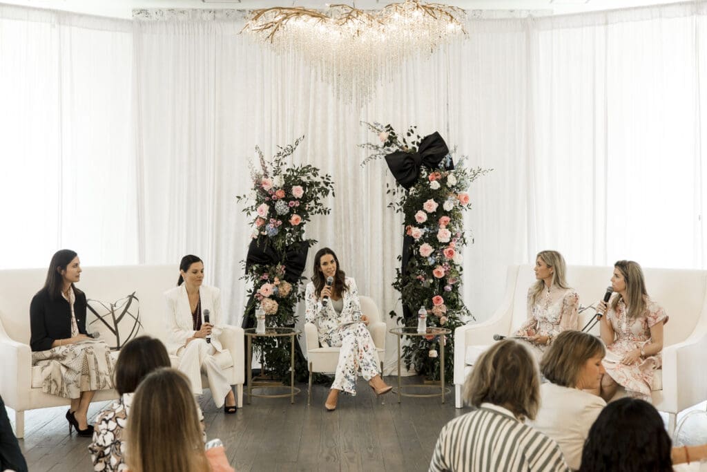 The panel of speakers gathers at The Peach Orchard during Interfaith Community Clinic’s Women Empowering Women event. (Photo courtesy Porterhouse Portraits)