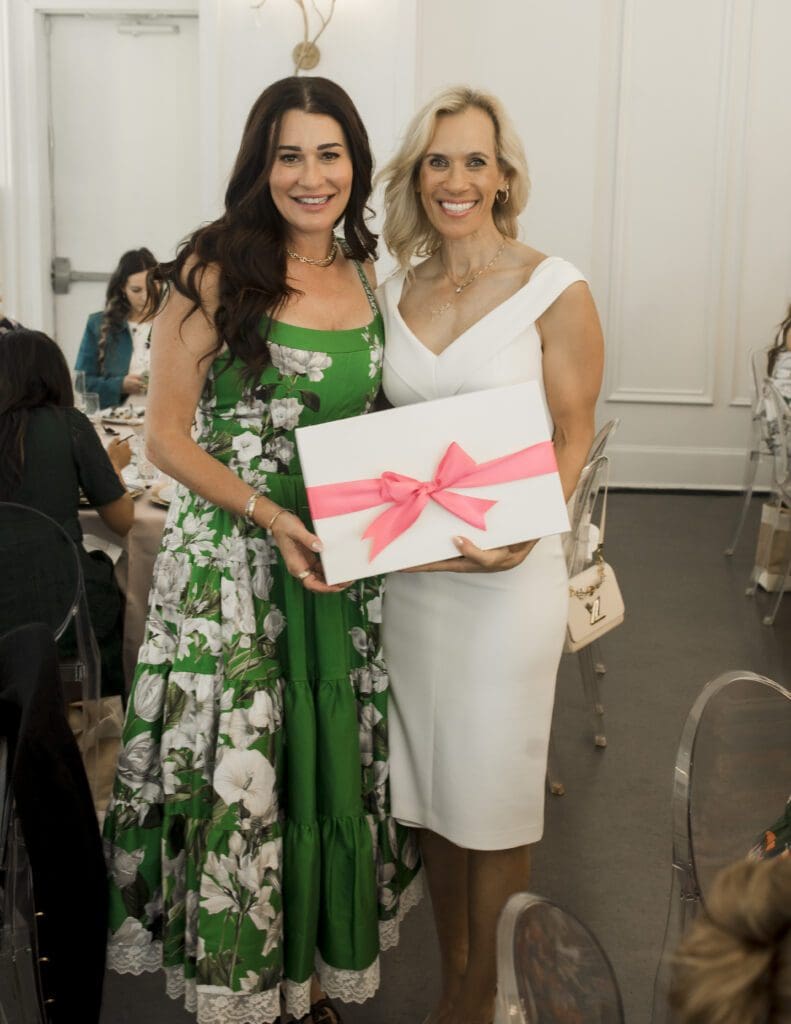 Missy Herndon, left, and Michelle Little of Waste Connections at the Women Empowering Women event at The Peach Orchard benefiting Interfaith Community Clinic. (Photo courtesy Porterhouse Portraits)