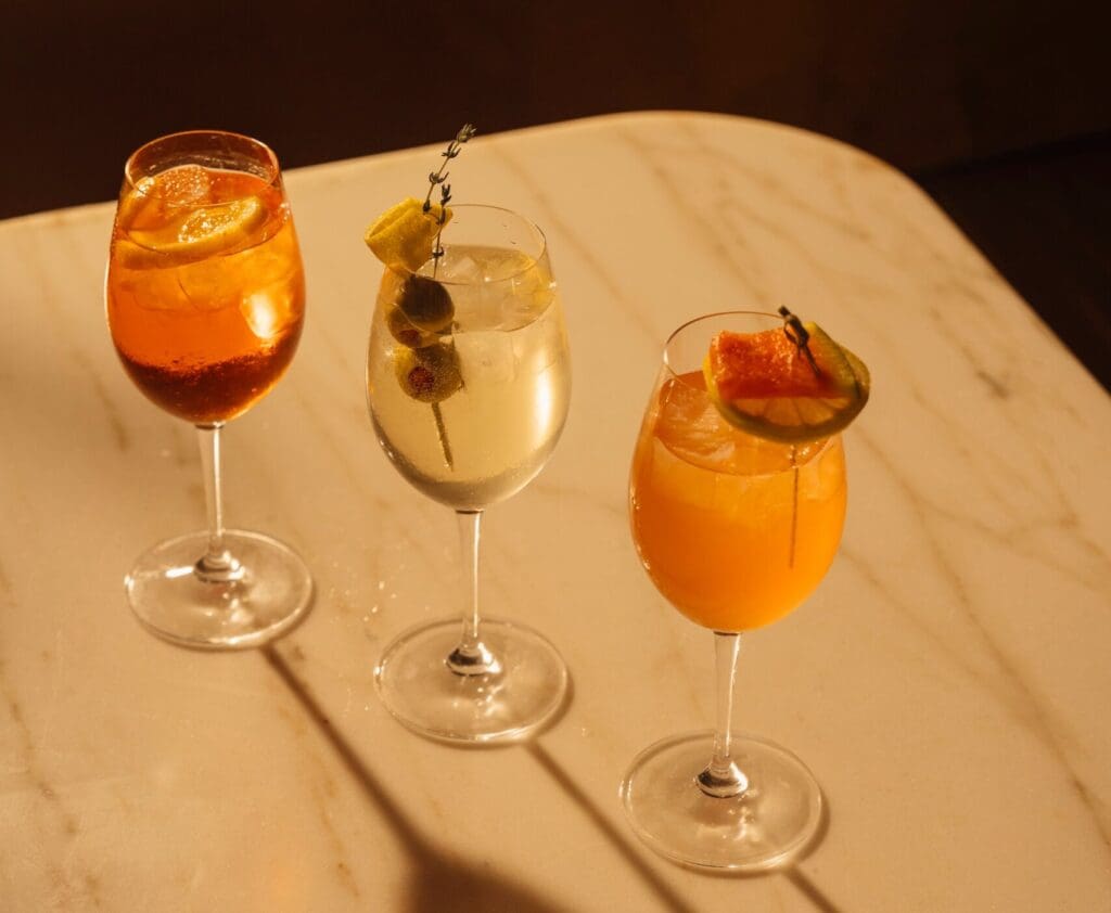 At Théa, The Spritz Parade is a trio of options featuring the Dirty Spritz, Parisian Spritz, and Aperol Spritz. (Courtesy)