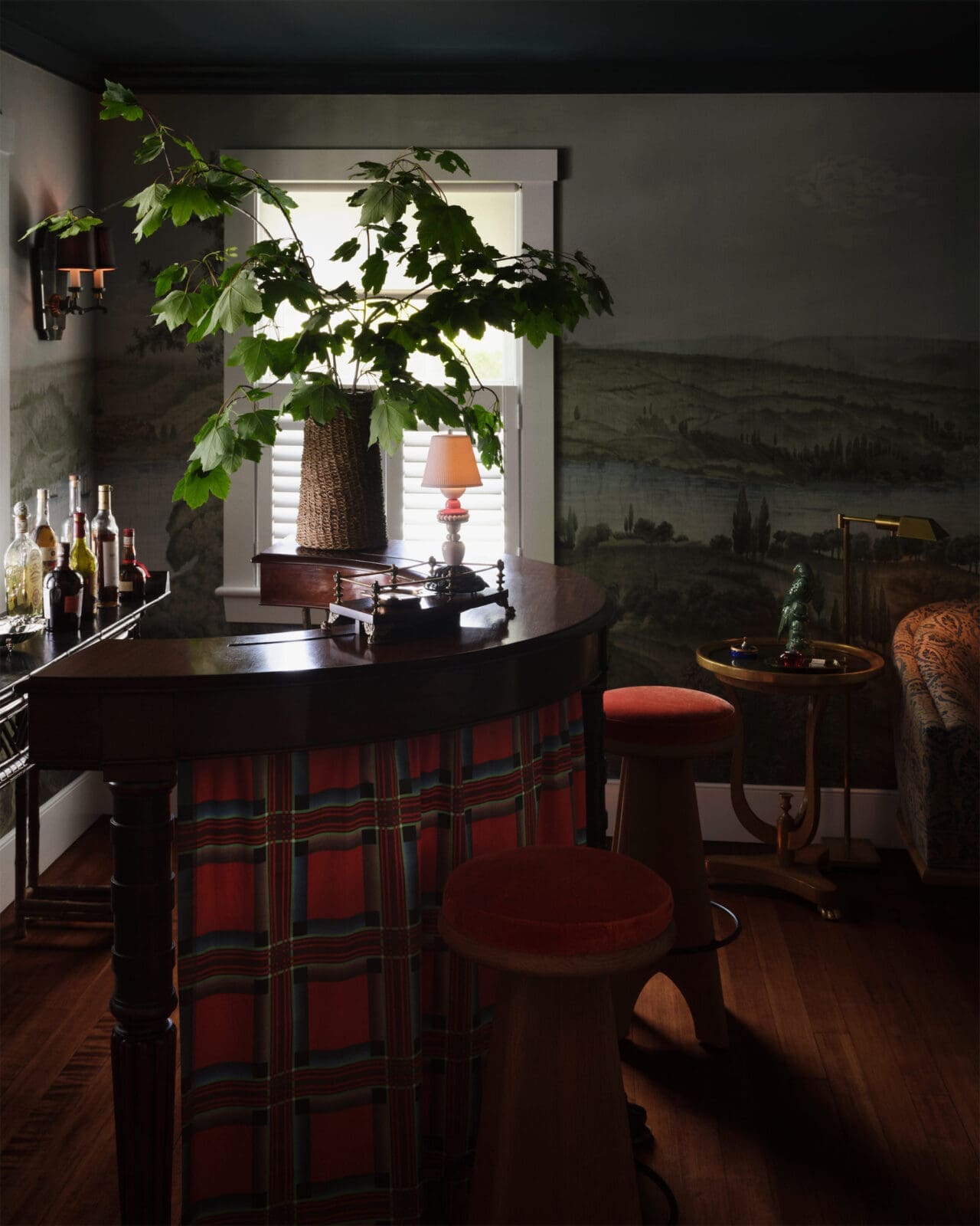  A vintage tartan fabric is used as a skirt for the antique English hunt bar. (Photo by Douglas Friedman) 