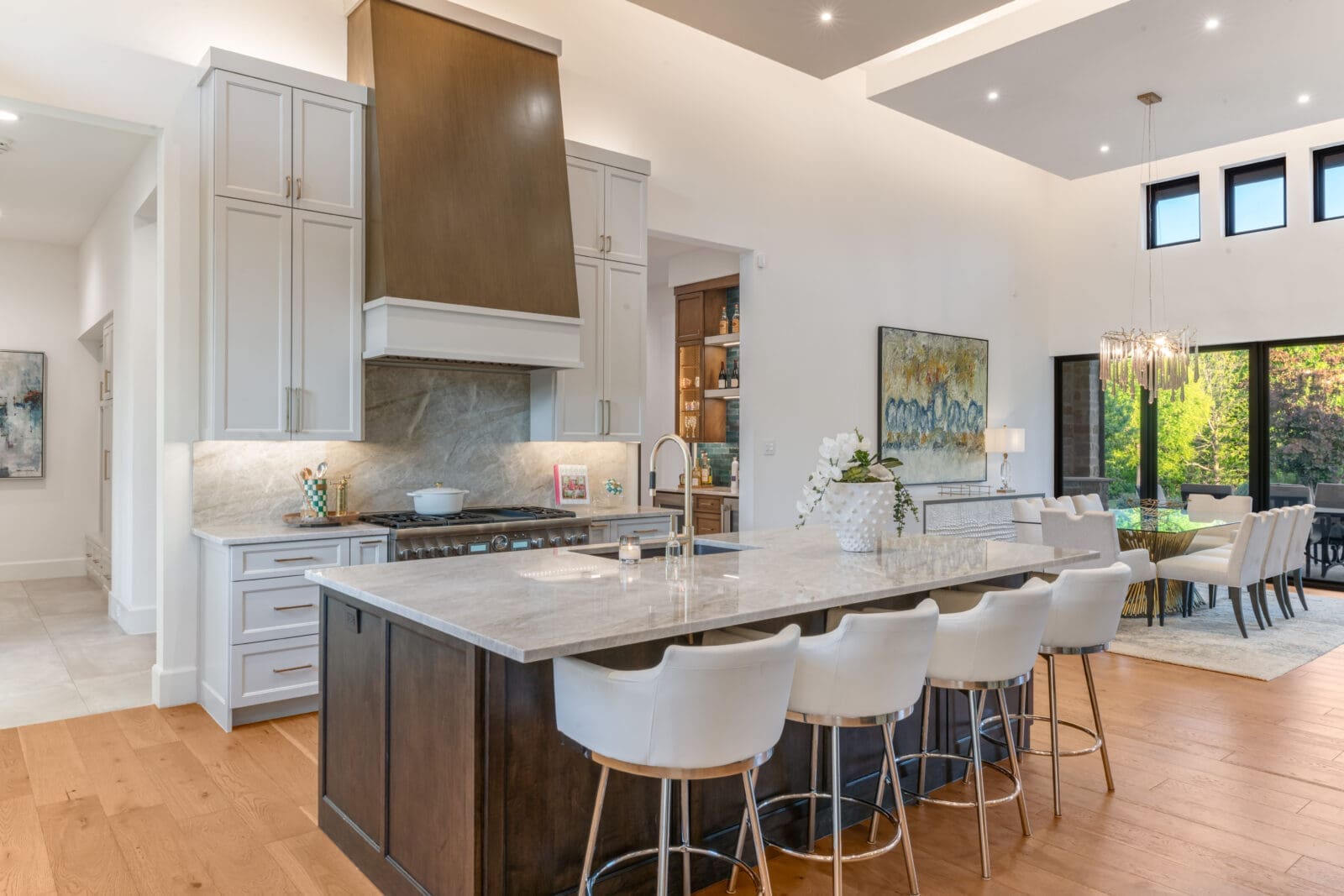 The home's epicenter and gathering point, the chef's kitchen features custom millwork with elevated finishes. (Photo by Costa Christ / Compass)