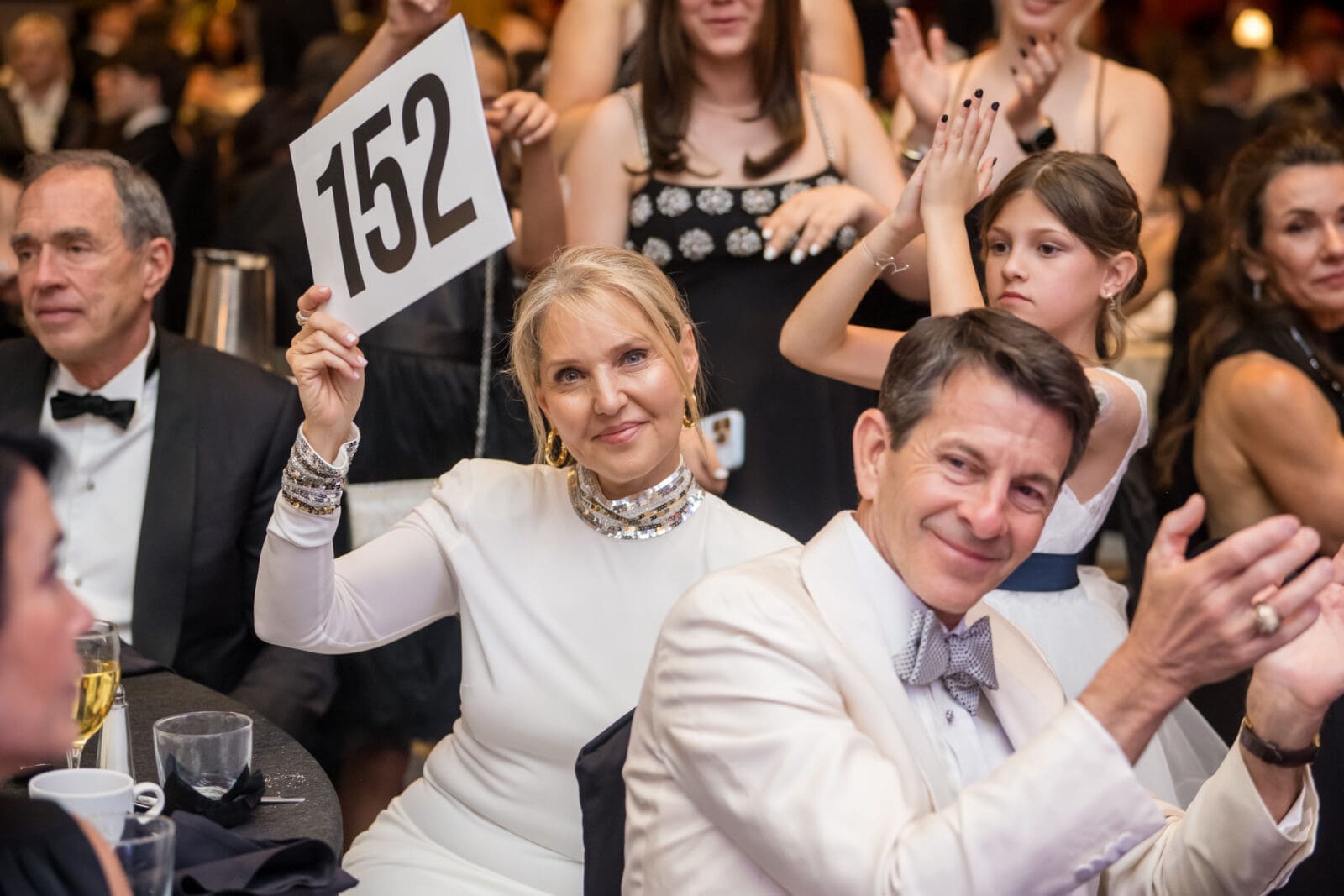 Amber & Clay Bretches bidding at the Breakthrough T1D (formerly JDRF) gala (PHoto by CJ Martinez)
