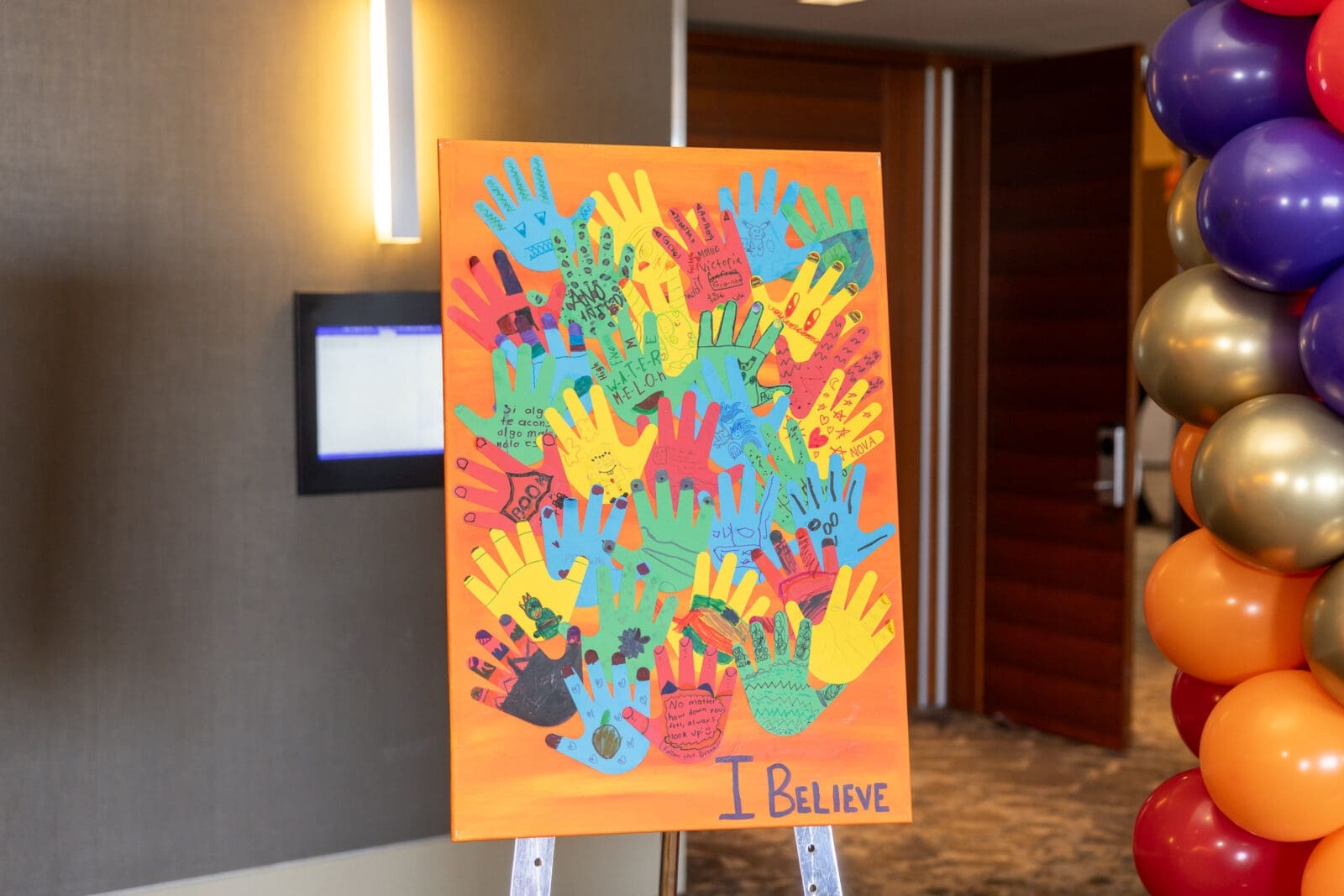 Brighter Days sign of children’s hands with positive affirmations. (Photo by Thomas Garza and Rob Wythe/Wythe Portrait Studio)